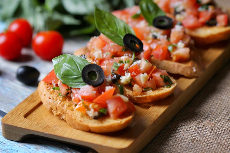 Bruschetta starter with tomatoes and basil